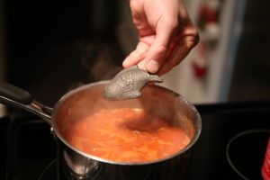 Lucky iron fish going into tomato soup